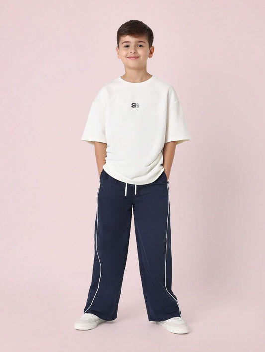 Tween Boys Comfy Oversized Fit Elbow Sleeve Tee With Small Graphic Print And Contrast Loose Fit Parachute Nylon Pant Navy Blue