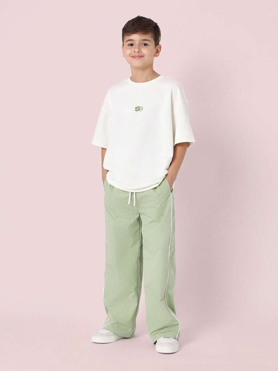 Tween Boys Comfy Oversized Fit Elbow Sleeve Tee With Small Graphic Print And Contrast Loose Fit Parachute Nylon Pant Olive Green